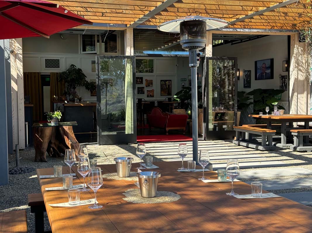 Outdoor wine tasting patio set with glasses at Raymond Burr Vineyards, Dry Creek Valley near Healdsburg